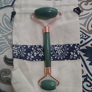 Pre owned jade and gold facial roller with bag